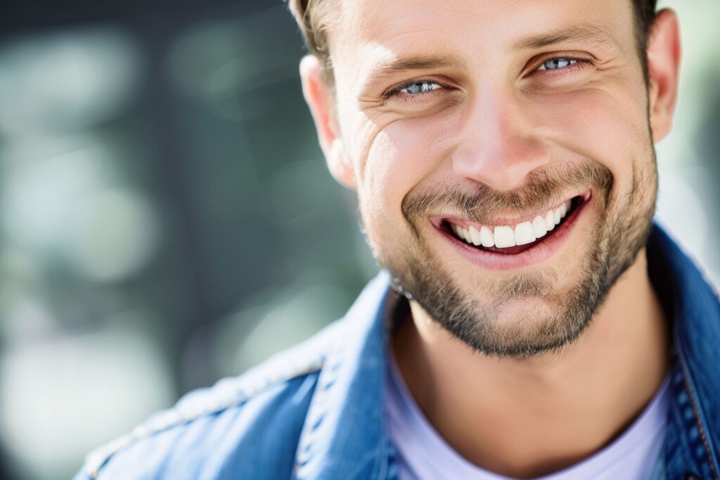 portrait of a man smiling at the camera